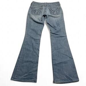 Bebe Early 2000s Low rise flare jeans with a blue wash a unique Mcbling size 28